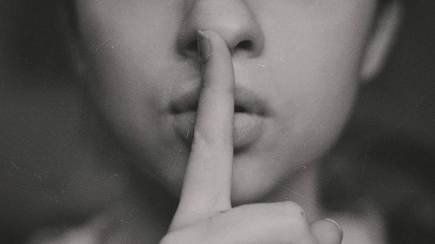 woman-finger-whisper-lip-845x475-1